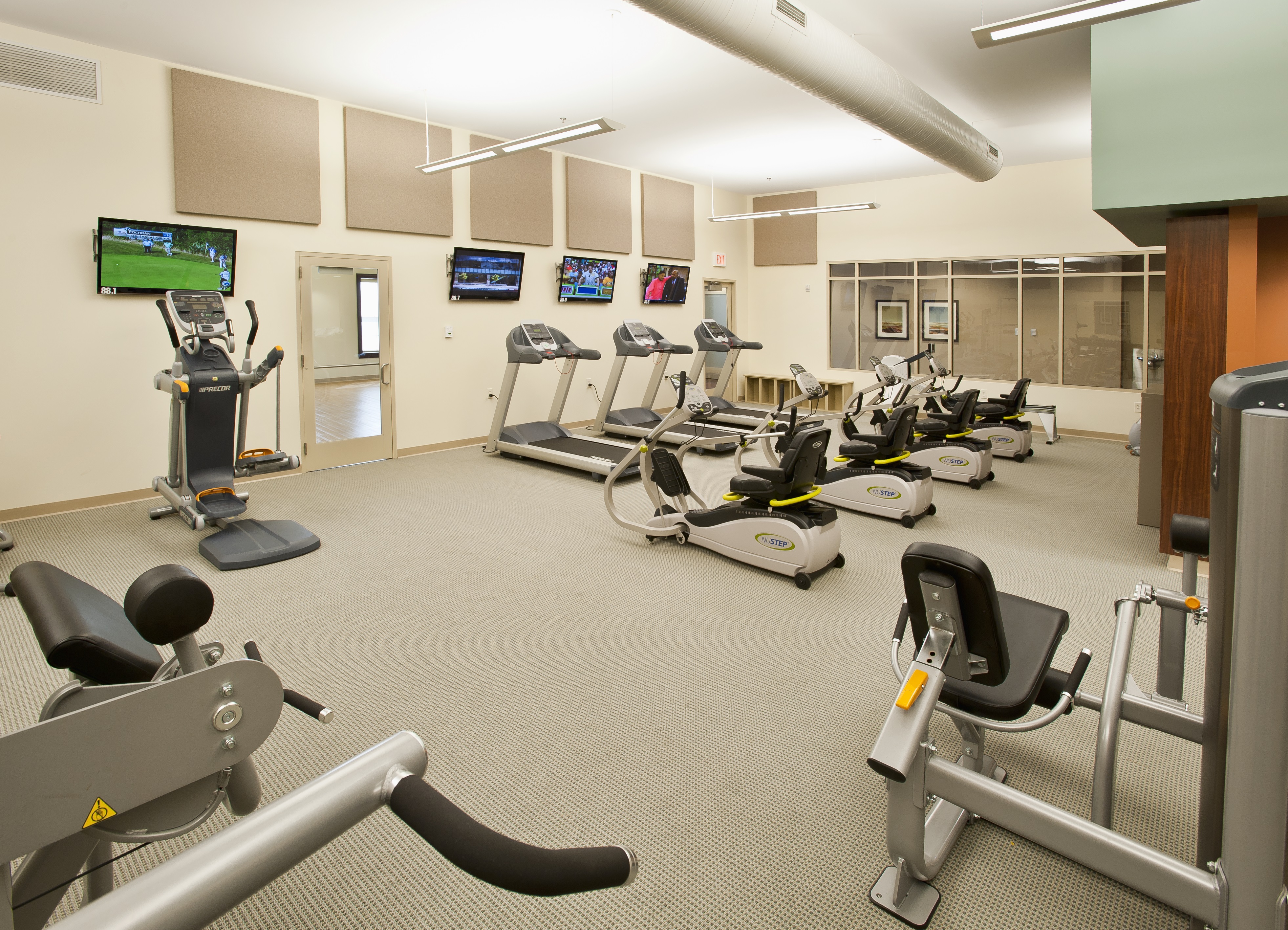 St Leonard workout facility with stair stepper, treadmills, sitting bikes, weight press, water, and much more 