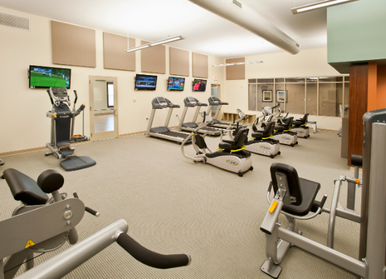 St Leonard workout facility with stair stepper, treadmills, sitting bikes, weight press, water, and much more